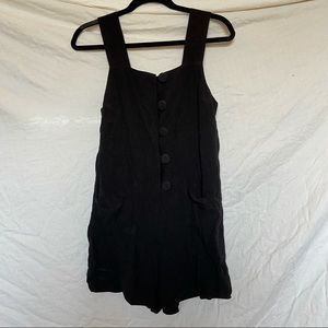 Black button up romper.